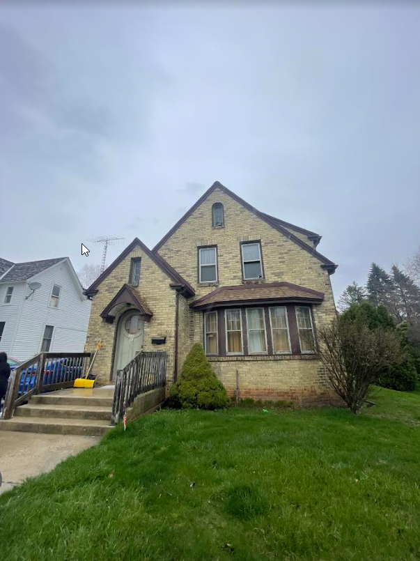 Two-story home with a covered porch